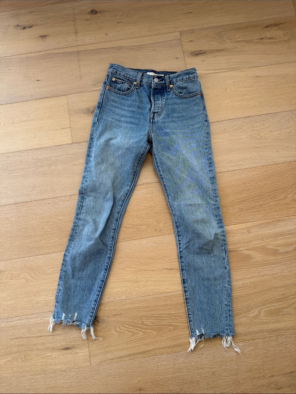 Levi's Denim Straight-Leg Jeans in Faded Blue with Raw Hem